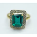 A 9ct gold and green stone ring, also set with four small diamonds, 3g, M