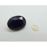 Two unmounted gemstones, blue sapphire, 15.50ct, and opal, 0.39ct, certified
