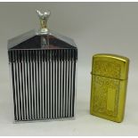 A Zippo lighter and a Rolls-Royce grill table lighter