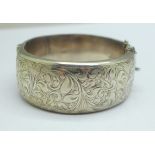 A wide hallmarked silver bangle, 44g, a/f, dented