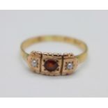 A yellow metal, garnet and pearl set ring, 1.7g, M, hallmark worn