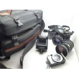 A Minolta 5000 camera, with additional lens, flash, light meter and remote and bag