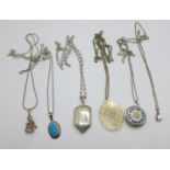 Three silver pendants, two silver lockets and five silver chains, and a small clown pendant with