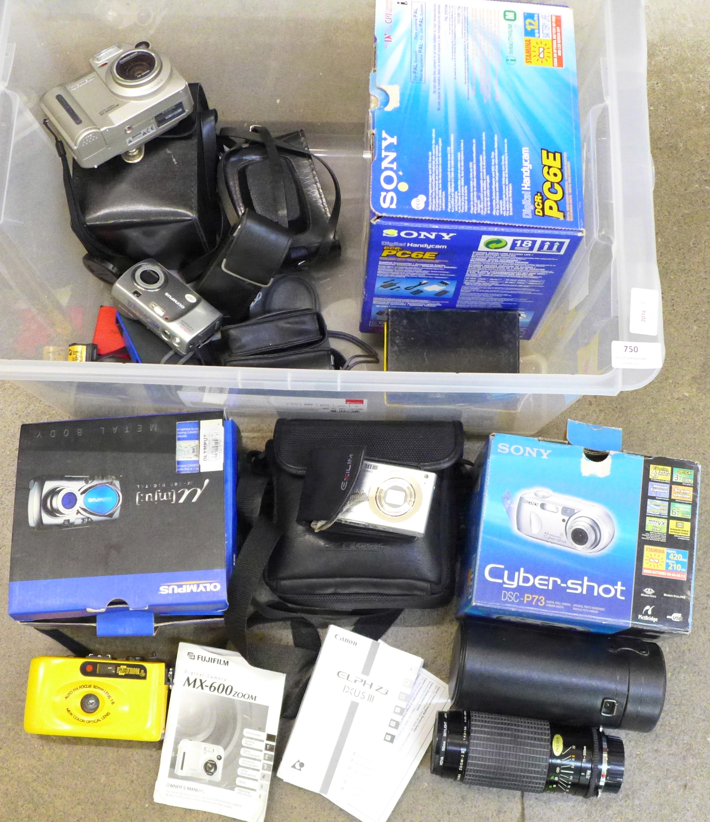 A collection of cameras and equipment, Olympus, Sony and other digital cameras, a Sigma zoom lens
