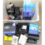 A collection of cameras and equipment, Olympus, Sony and other digital cameras, a Sigma zoom lens