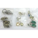 Seven pairs of silver earrings