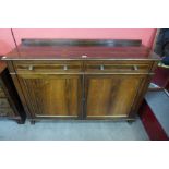 A Regency rosewood and brass inlaid side cabinet
