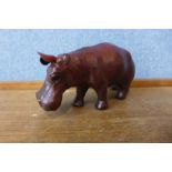 A small brown leather hippopotamus