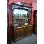 An Edward VII carved walnut mirrorback sideboard