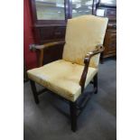 A George III mahogany and upholstered open armchair