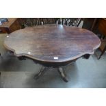A 19th Century French rosewood two drawer serpentine centre table