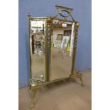 An Art Nouveau brass firescreen