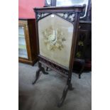 A Victorian Gothic Revival mahogany fire screen