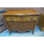 A 19th Century French satinwood and gilt metal mounted tambour front serpentine commode