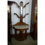 A Victorian walnut and marble topped tree shaped hallstand