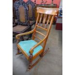 A Victorian mahogany rocking chair