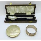 A silver spoon, napkin ring and compact marked 833, (spoon and napkin ring 30g)