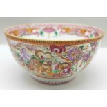 A Chinese famille rose hunting bowl with two panels of fox hunting scenes, galloping riders,