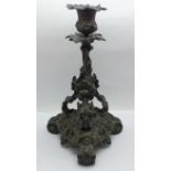 A bronze rococo candlestick