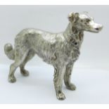 A silver plated model of a dog