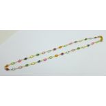 A yellow metal multi-gem set necklace, with tag marked 750