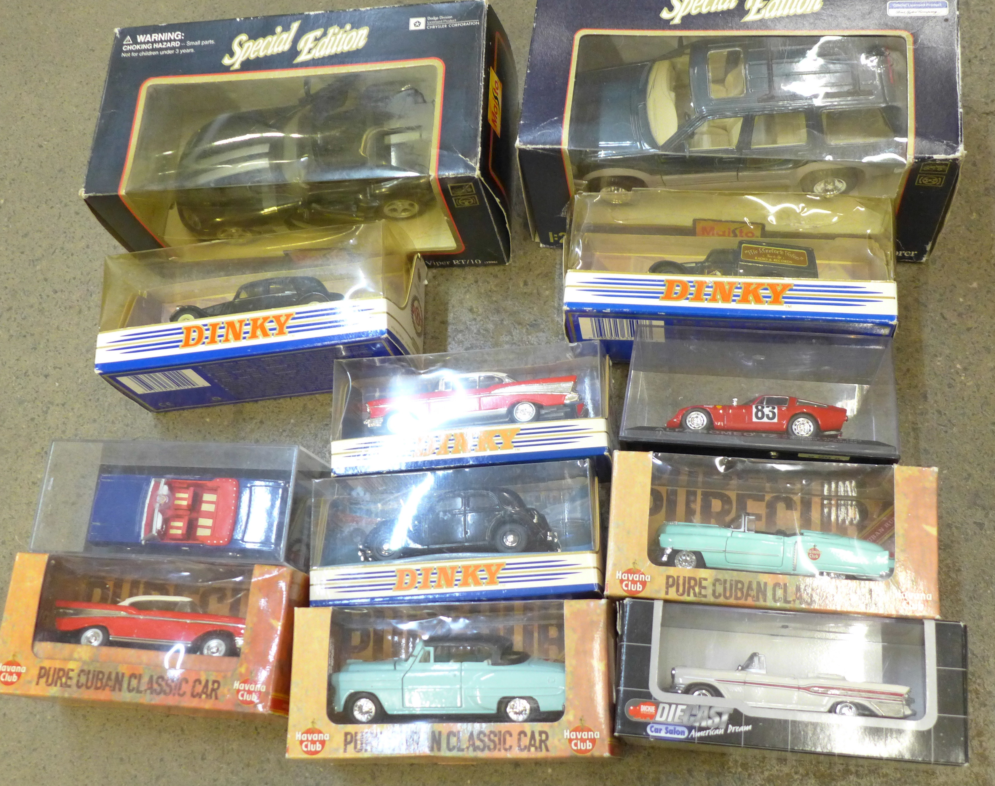 Twelve die-cast model vehicles including Maisto Dodge Viper RT/10 and '95 Ford Explorer, boxed