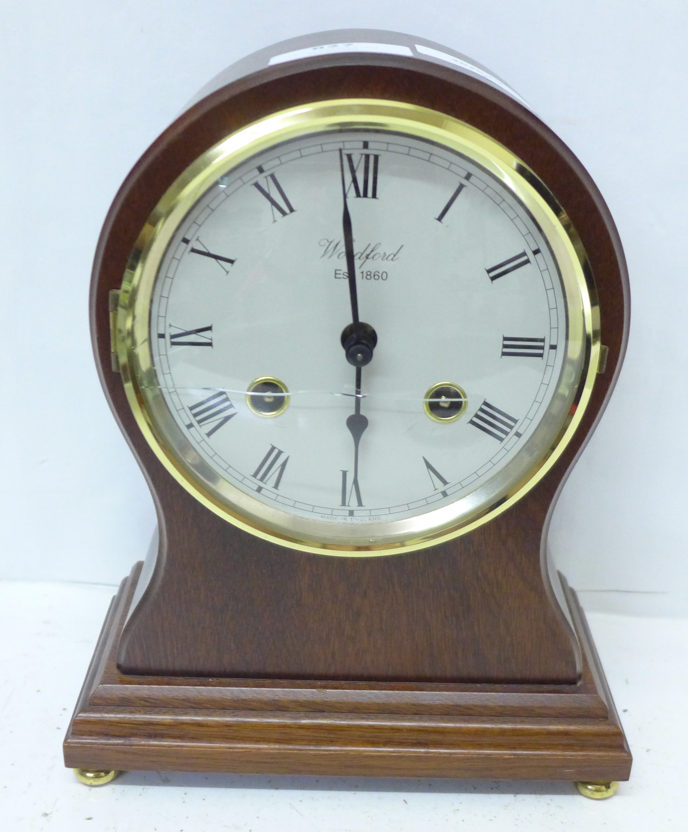 A Woodford floating balance clock with striking Franz Hermle movement, glass a/f