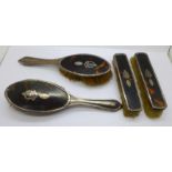Four silver and tortoiseshell brushes, a/f
