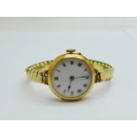 A lady's 15ct gold cased wristwatch, London import mark for 1913, 26mm case, on an expanding