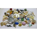 Sixty brooches