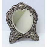 A William Comyns silver mirror, London 1908, with heart shaped bevelled glass, height 34cm