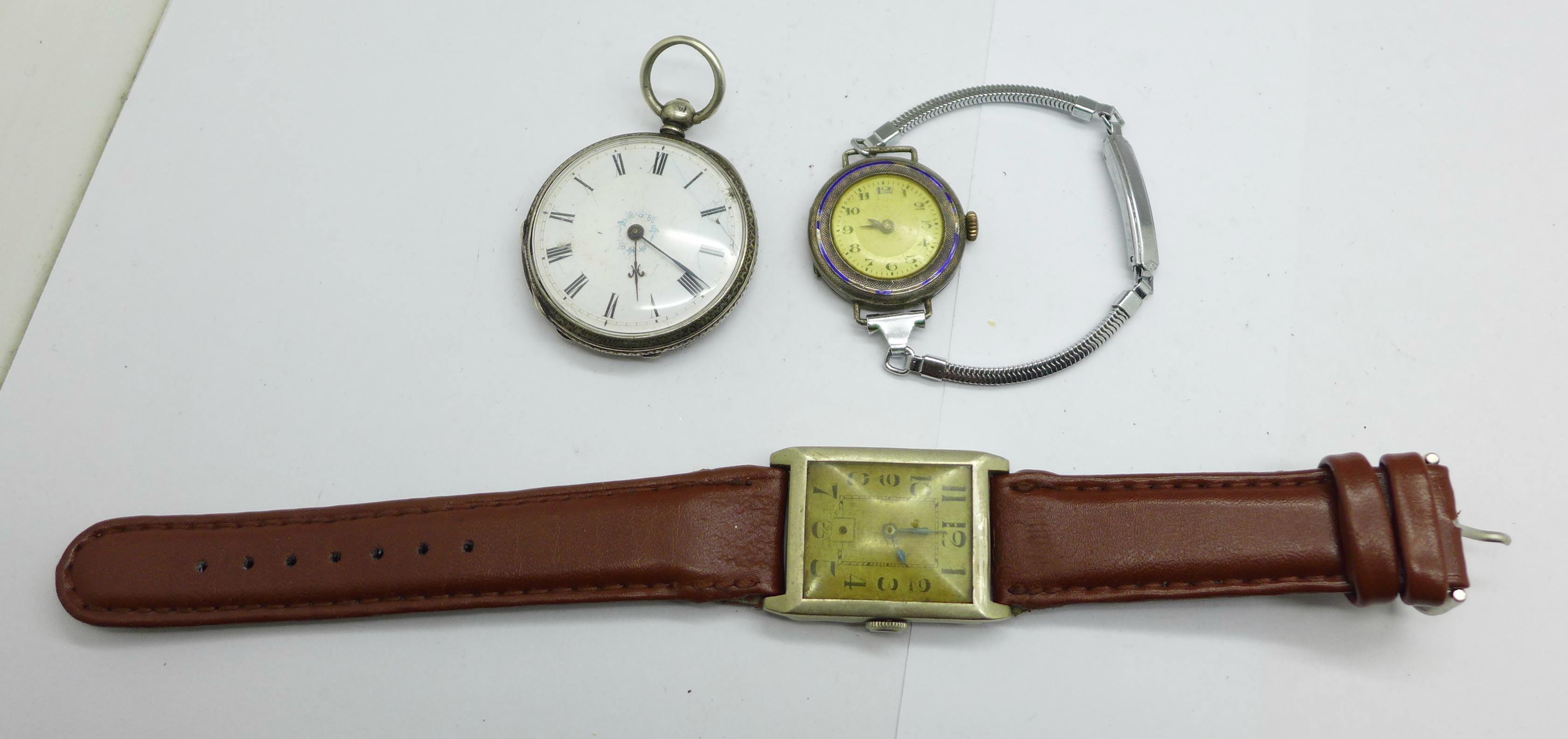 Three watches; a silver fob watch, lady's silver wristwatch and a gentlemen's nickel cased