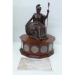 An exclusive bronzed sculpture of Britannia set on a revolving wooden plinth featuring twelve