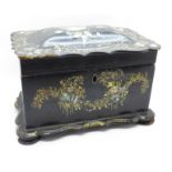 A 19th Century papier mache tea caddy inlaid with abalone, one foot replaced, a/f (small losses