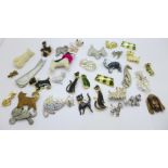 A collection of cat and dog brooches