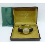 A 9ct gold Longines wristwatch, with box and paperwork, the case back bears inscription