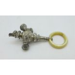 A Victorian silver and mother of pearl rattle/whistle, Birmingham 1897, lacking one bell