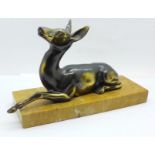 An Art Deco gilt spelter model of a doe on a marble base, base 21.5cm