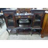 An Edward VII carved mahogany side cabinet