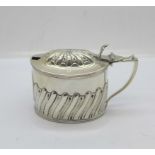 A late Victorian silver mustard, Birmingham 1897, weight without liner 74g, liner a/f