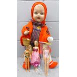 A large doll and three others including Sindy