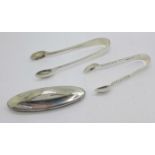 Two pairs of silver sugar tongs, 42g, and a silver mounted nail buffer