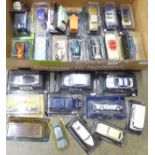 A collection of die-cast model vehicles, packaged, over 25 in total