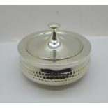 A hammered silver pot with lid, marked '935 silver', 285g