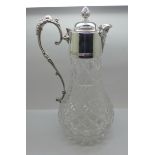 A white metal mounted glass claret jug, marked 999 on the handle and lid