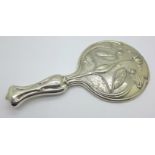 An Art Nouveau silver backed hand mirror, Chester 1906