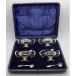 A set of four silver salts with blue glass liners, Birmingham 1907, the spoons hallmarked London