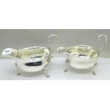 Two similar silver sauce boats, both marked Harrods, London S.W., and both hallmarked London 1914,