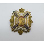 A Queen Victoria 1837/1897 Queen and Empress enamel badge