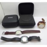 Three wristwatches and two Rado travel pouches